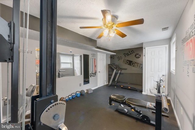 2116 Bell Tree Ln, Waldorf, MD 20601 - exercise room featuring a textured ceiling, ceiling fan, and baseboards