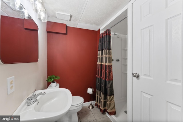 2116 Bell Tree Ln, Waldorf, MD 20601 - full bathroom featuring a stall shower, tile patterned flooring, a sink, toilet, and a textured ceiling