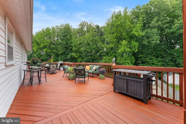 2116 Bell Tree Ln, Waldorf, MD 20601 - wooden deck featuring outdoor dining space, an outdoor living space, and view of wooded area