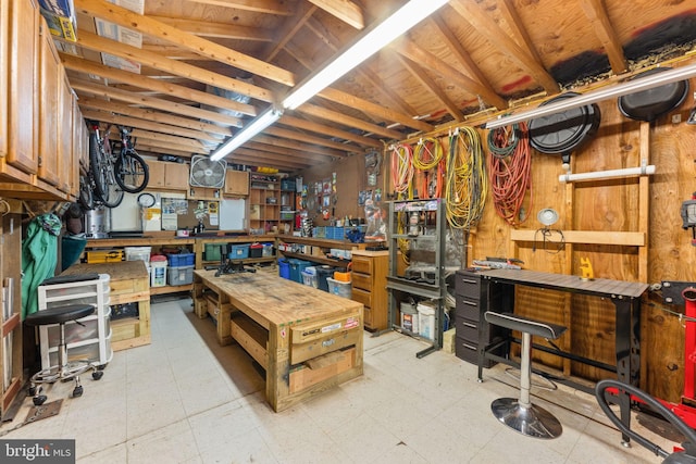 2116 Bell Tree Ln, Waldorf, MD 20601 - below grade area featuring a workshop area and light floors