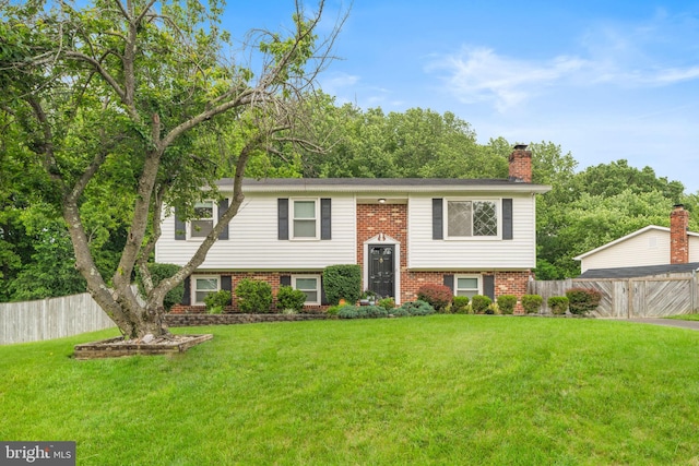 2116 Bell Tree Ln, Waldorf, MD 20601 - split foyer home featuring brick siding and a chimney