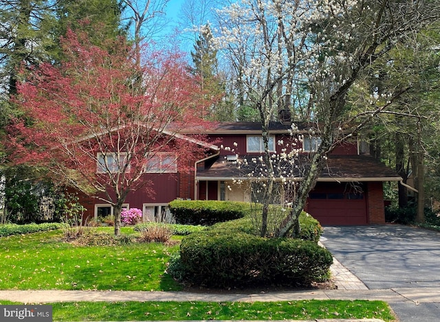 490 Orlando Ave, State College, PA 16803 - view of front of house with a garage, driveway, and brick siding