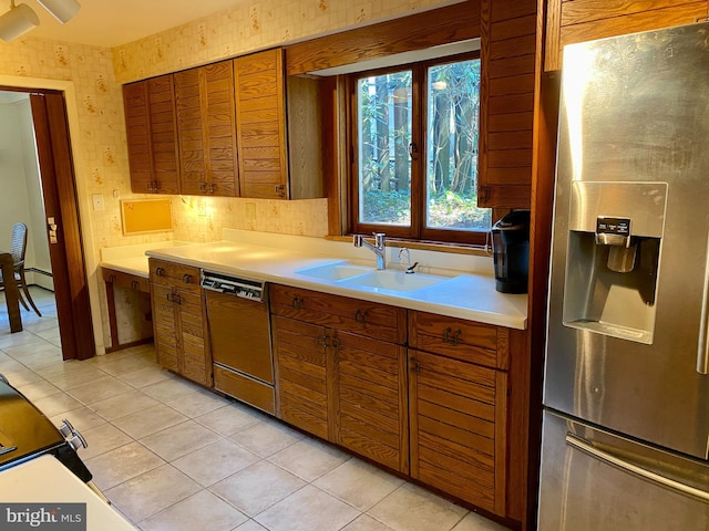 490 Orlando Ave, State College, PA 16803 - kitchen with stainless steel refrigerator with ice dispenser, dishwasher, light countertops, brown cabinetry, and wallpapered walls