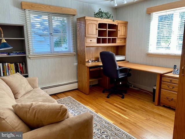 490 Orlando Ave, State College, PA 16803 - home office with wallpapered walls, a baseboard radiator, light wood finished floors, built in desk, and plenty of natural light