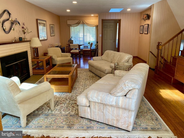 490 Orlando Ave, State College, PA 16803 - living area featuring wood finished floors, stairs, a fireplace, and recessed lighting