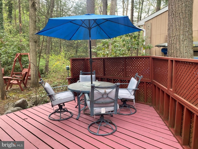 490 Orlando Ave, State College, PA 16803 - deck featuring outdoor dining space and a wooded view