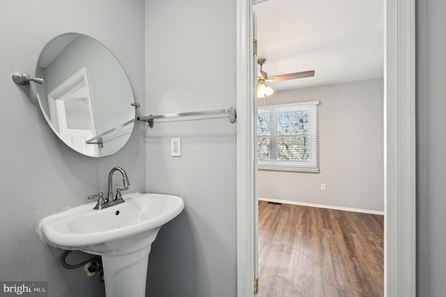 1943 Brookside Dr, Edgewood, MD 21040 - bathroom with baseboards, a ceiling fan, wood finished floors, and a sink