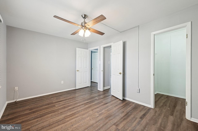 1943 Brookside Dr, Edgewood, MD 21040 - unfurnished bedroom featuring dark wood finished floors, a walk in closet, a closet, baseboards, and ceiling fan