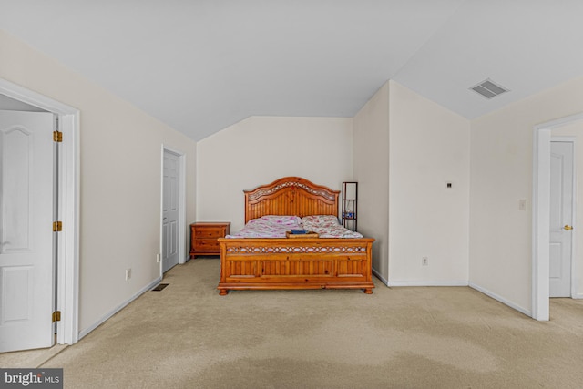bedroom with baseboards, vaulted ceiling, visible vents, and carpet