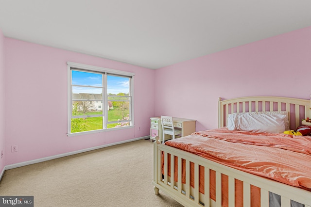 carpeted bedroom with baseboards