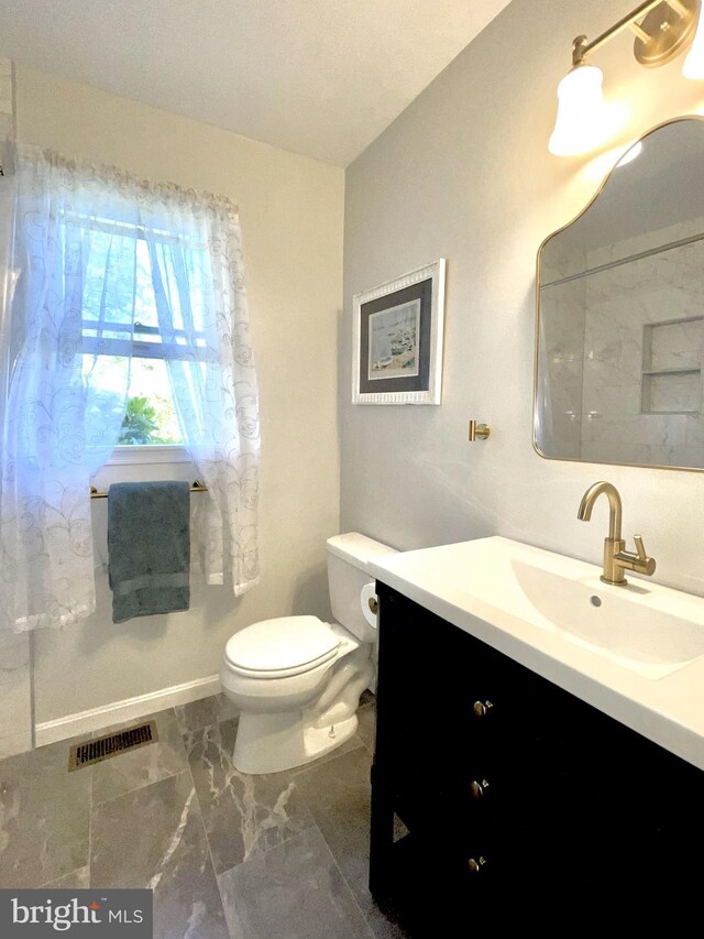 bathroom with vanity, marble finish floor, visible vents, and toilet