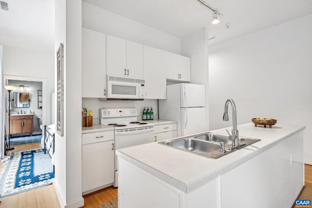 820 E High St Unit 1, Charlottesville, VA 22902 - kitchen featuring track lighting, white appliances, a sink, white cabinetry, and light wood-type flooring