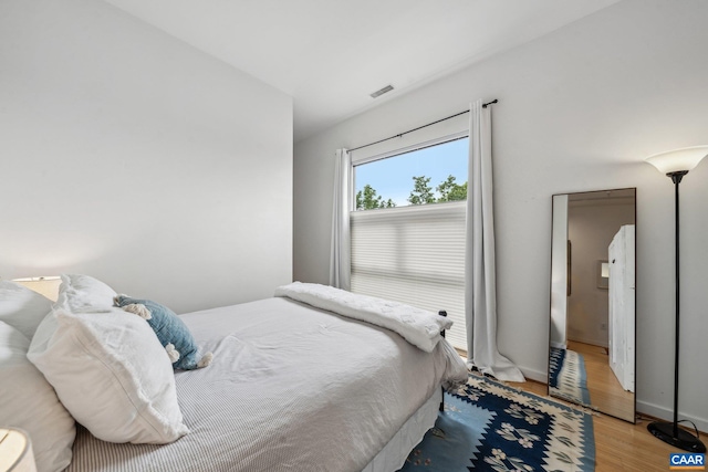 820 E High St Unit 1, Charlottesville, VA 22902 - bedroom with visible vents, baseboards, and light wood-type flooring