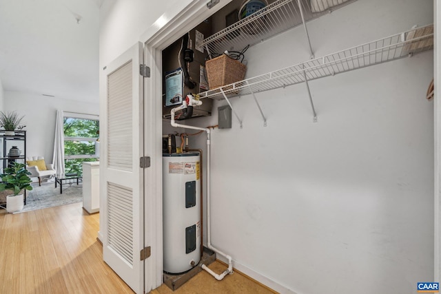 820 E High St Unit 1, Charlottesville, VA 22902 - utility room featuring electric water heater