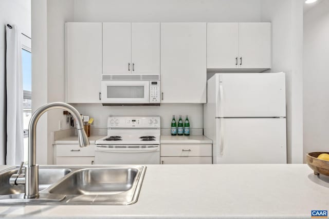 820 E High St Unit 1, Charlottesville, VA 22902 - kitchen with white appliances, light countertops, white cabinets, and a sink