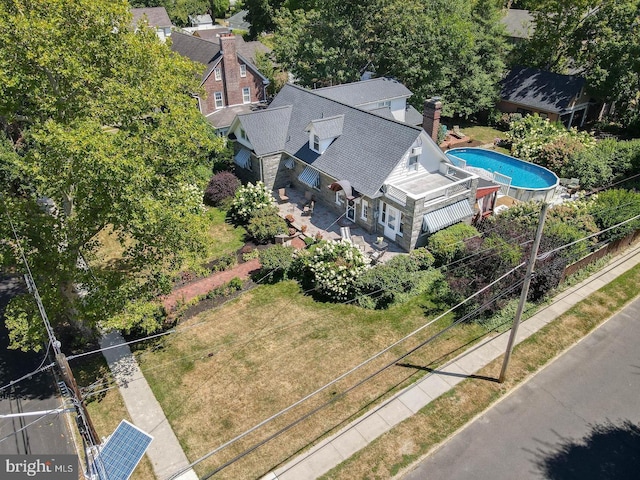 view of subject property with a pool area