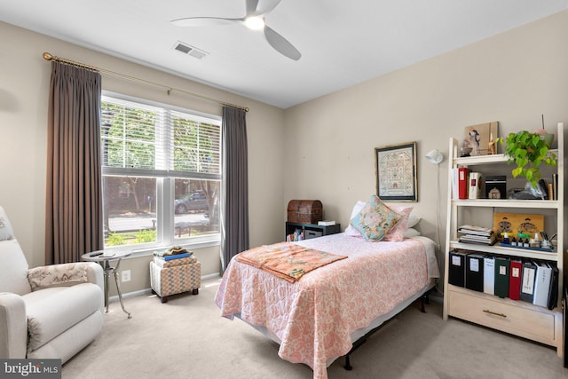 bedroom with baseboards, a ceiling fan, carpet flooring, and visible vents