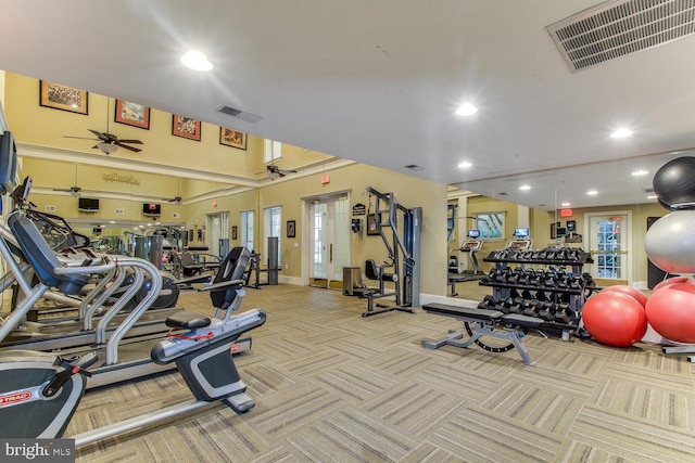 exercise room featuring recessed lighting, a ceiling fan, and visible vents