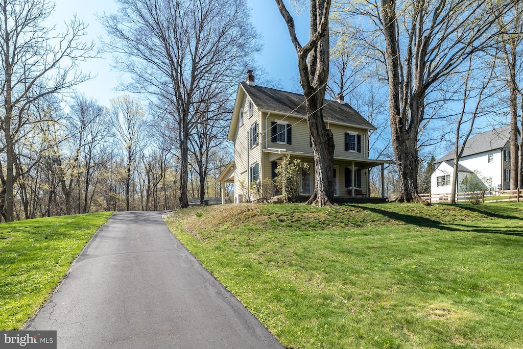 2655 Valley Rd, Jamison, PA 18929 - view of front of property featuring a front lawn, a chimney, and covered porch
