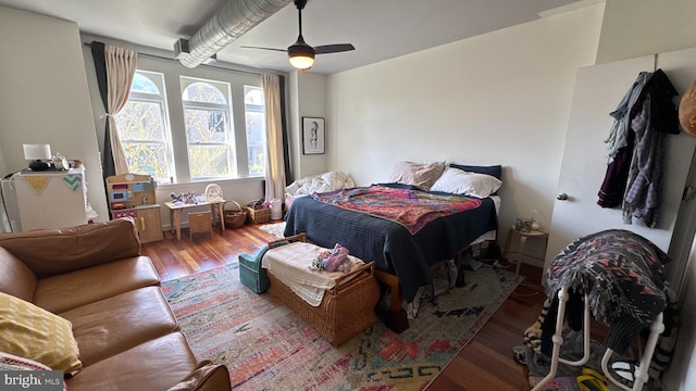bedroom with wood finished floors and ceiling fan