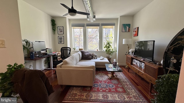 living room featuring wood finished floors and a ceiling fan