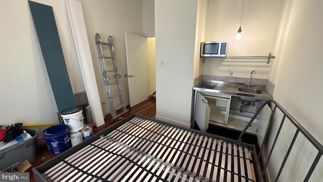 kitchen with stainless steel counters, stainless steel microwave, and a sink