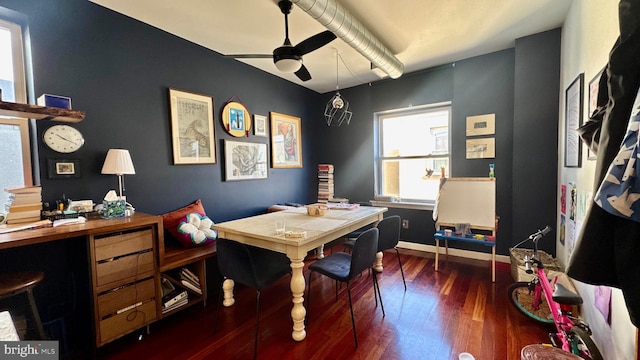 office area featuring baseboards, ceiling fan, and dark wood-style flooring
