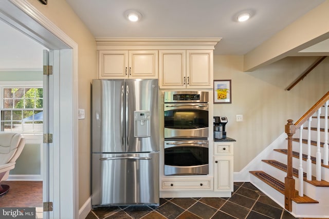 1217 Stafford Ave, Fredericksburg, VA 22401 - kitchen with baseboards, cream cabinetry, and stainless steel appliances