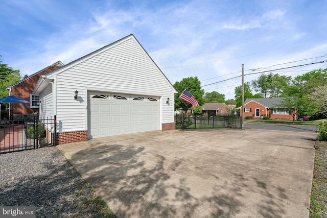 1217 Stafford Ave, Fredericksburg, VA 22401 - garage with concrete driveway and fence
