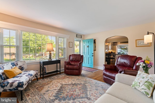 1217 Stafford Ave, Fredericksburg, VA 22401 - living area featuring baseboards, arched walkways, and wood finished floors