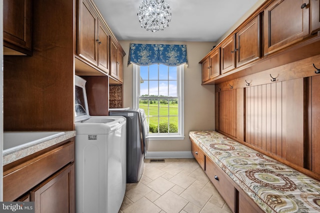 81 Stewart Rd, Pilesgrove, NJ 08098 - washroom featuring visible vents, a sink, independent washer and dryer, baseboards, and a chandelier