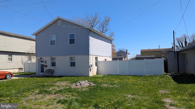 9225 Milnor St, Philadelphia, PA 19114 - view of side of home featuring a lawn, fence, and brick siding