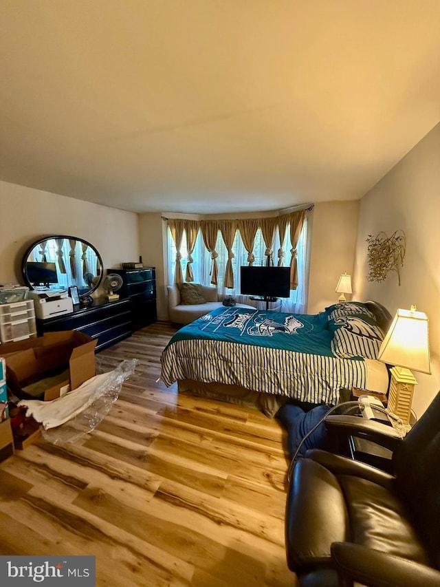 bedroom featuring wood finished floors
