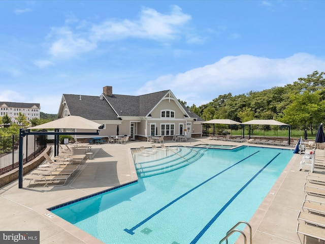 601 Quicksilver Ct Unit 401, Reisterstown, MD 21136 - community pool featuring a patio