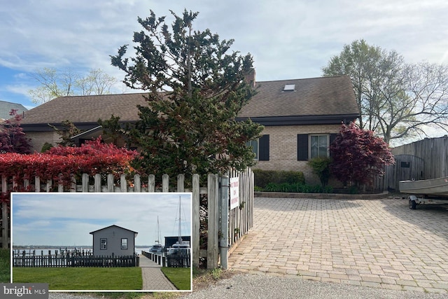 3689 1st Ave, Edgewater, MD 21037 - view of front of home with brick siding and roof with shingles