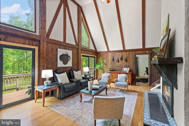 11713 Henderson Rd, Clifton, VA 20124 - living room with wood walls, beamed ceiling, high vaulted ceiling, and wood finished floors