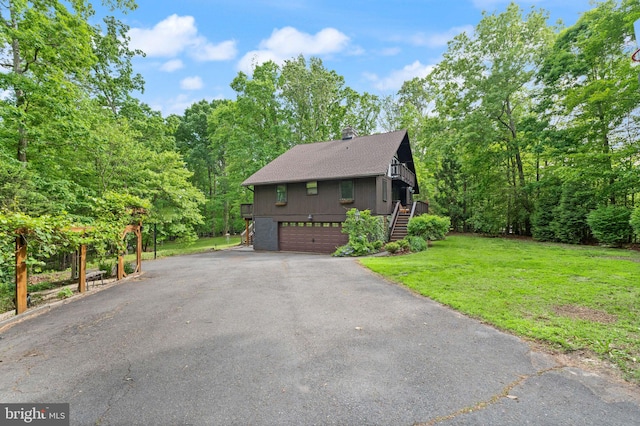 11713 Henderson Rd, Clifton, VA 20124 - view of side of home featuring stairway, driveway, a lawn, a garage, and a chimney