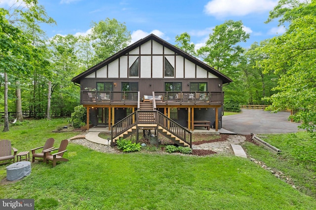 11713 Henderson Rd, Clifton, VA 20124 - back of property with a deck, stairs, a yard, and a patio