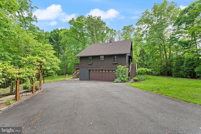 11713 Henderson Rd, Clifton, VA 20124 - view of property exterior with stairs, driveway, a yard, a garage, and a chimney
