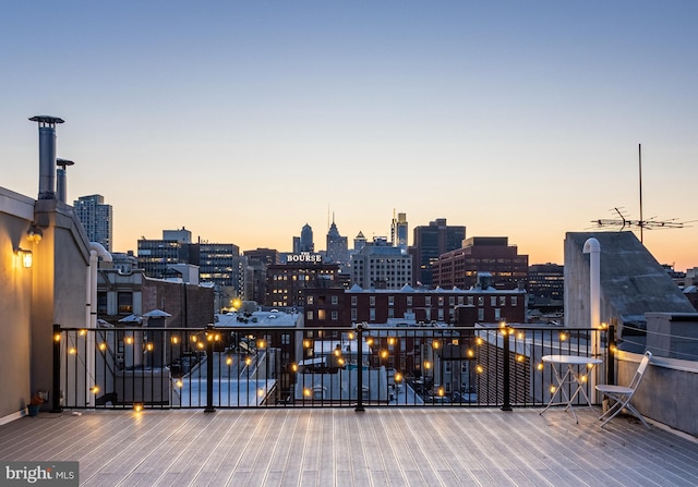 deck at dusk with a city view