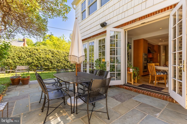 view of patio / terrace with outdoor dining area and french doors