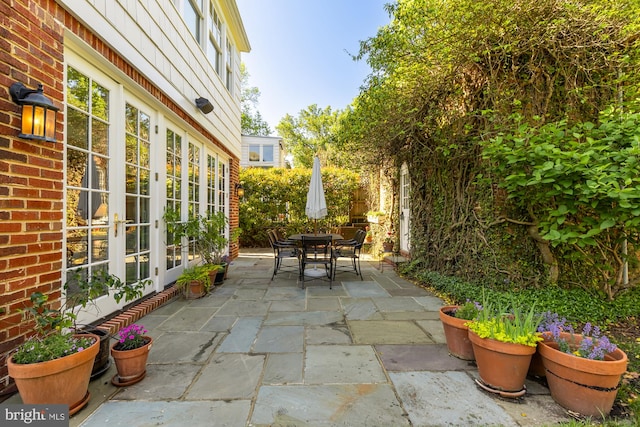 view of patio / terrace featuring french doors and outdoor dining area