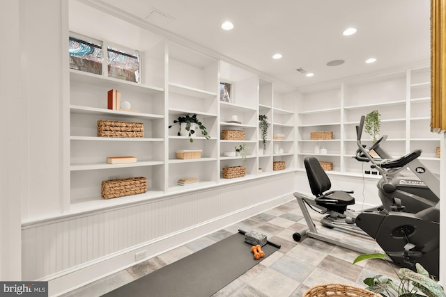 workout room with recessed lighting and built in features