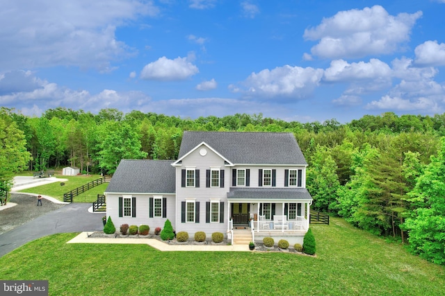 6735 Thornbrook Ln, Spotsylvania, VA 22551 - colonial inspired home with a porch, a shingled roof, and a front lawn