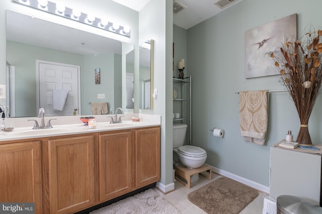 full bathroom with visible vents, a sink, double vanity, and toilet