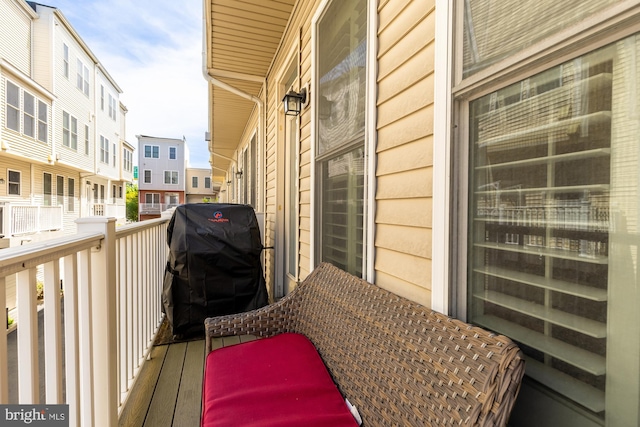 balcony with a grill and a residential view