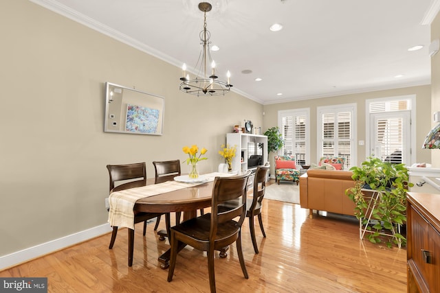 dining area with recessed lighting, crown molding, light wood finished floors, a chandelier, and baseboards