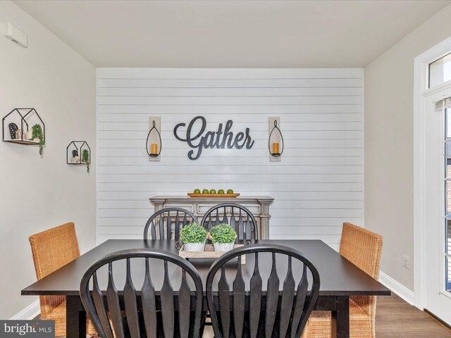 dining room with baseboards and wood finished floors