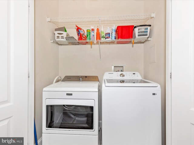 laundry area with washer and dryer and laundry area