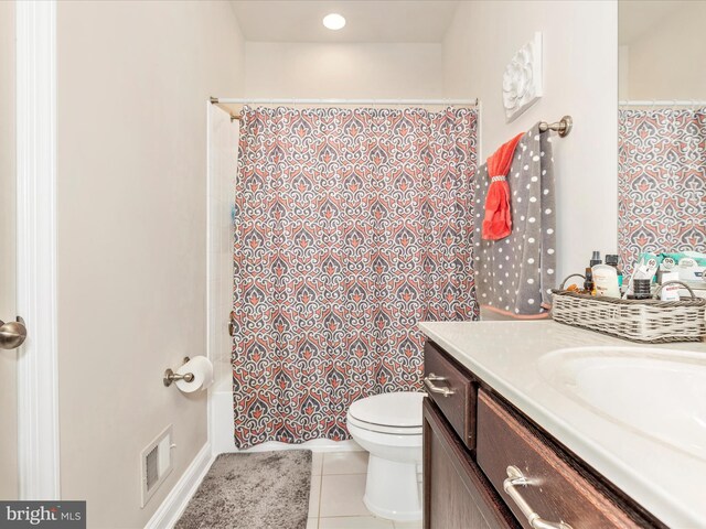 bathroom with tile patterned floors, toilet, visible vents, a shower with shower curtain, and vanity